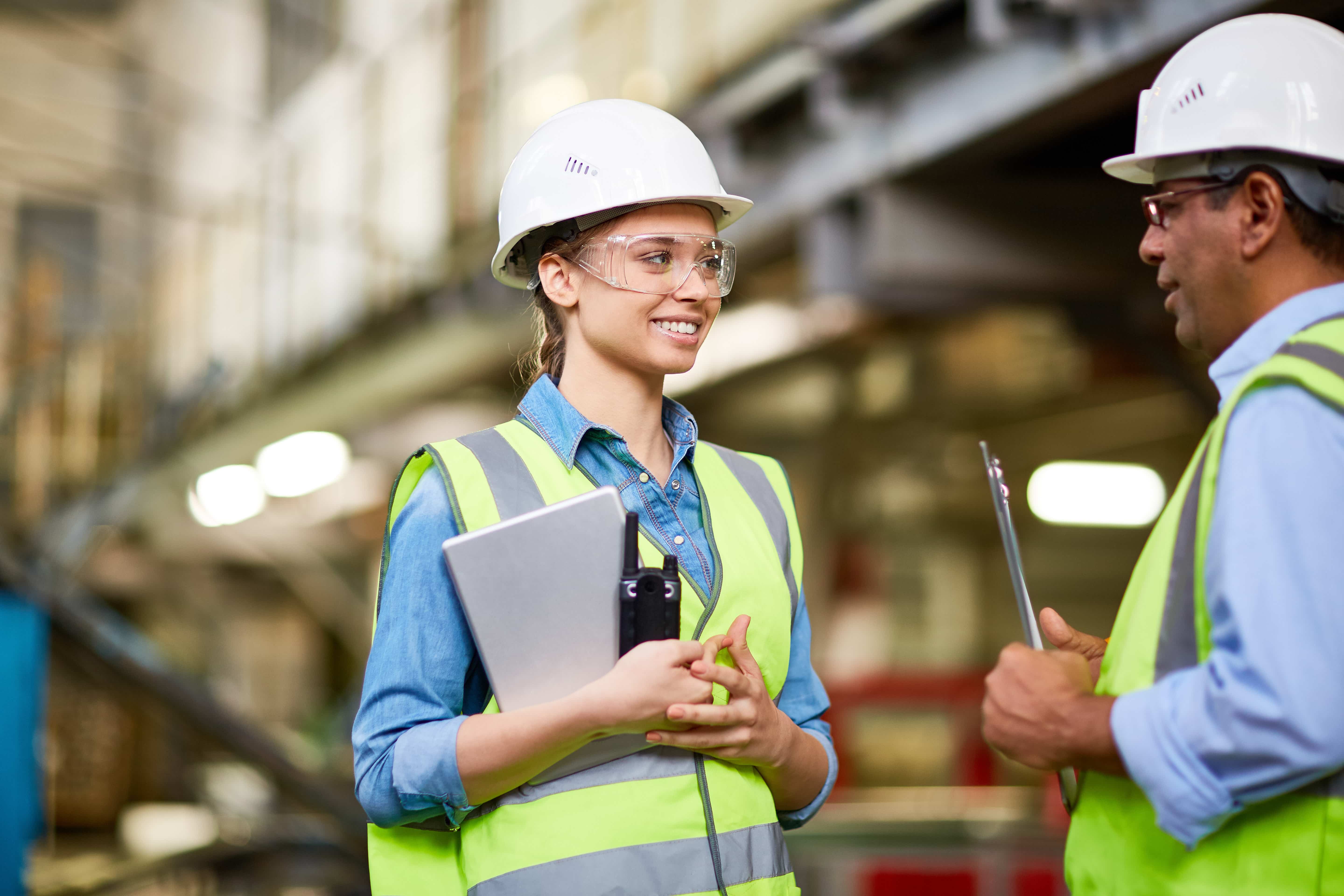 apprentice and employer in hard hats