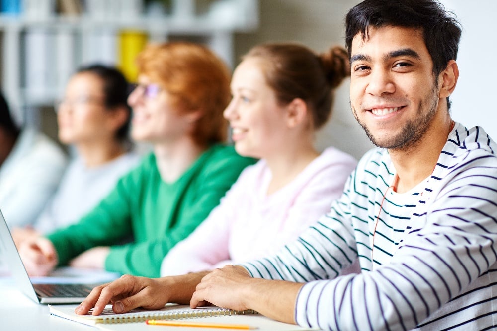 4 adult learners at a table