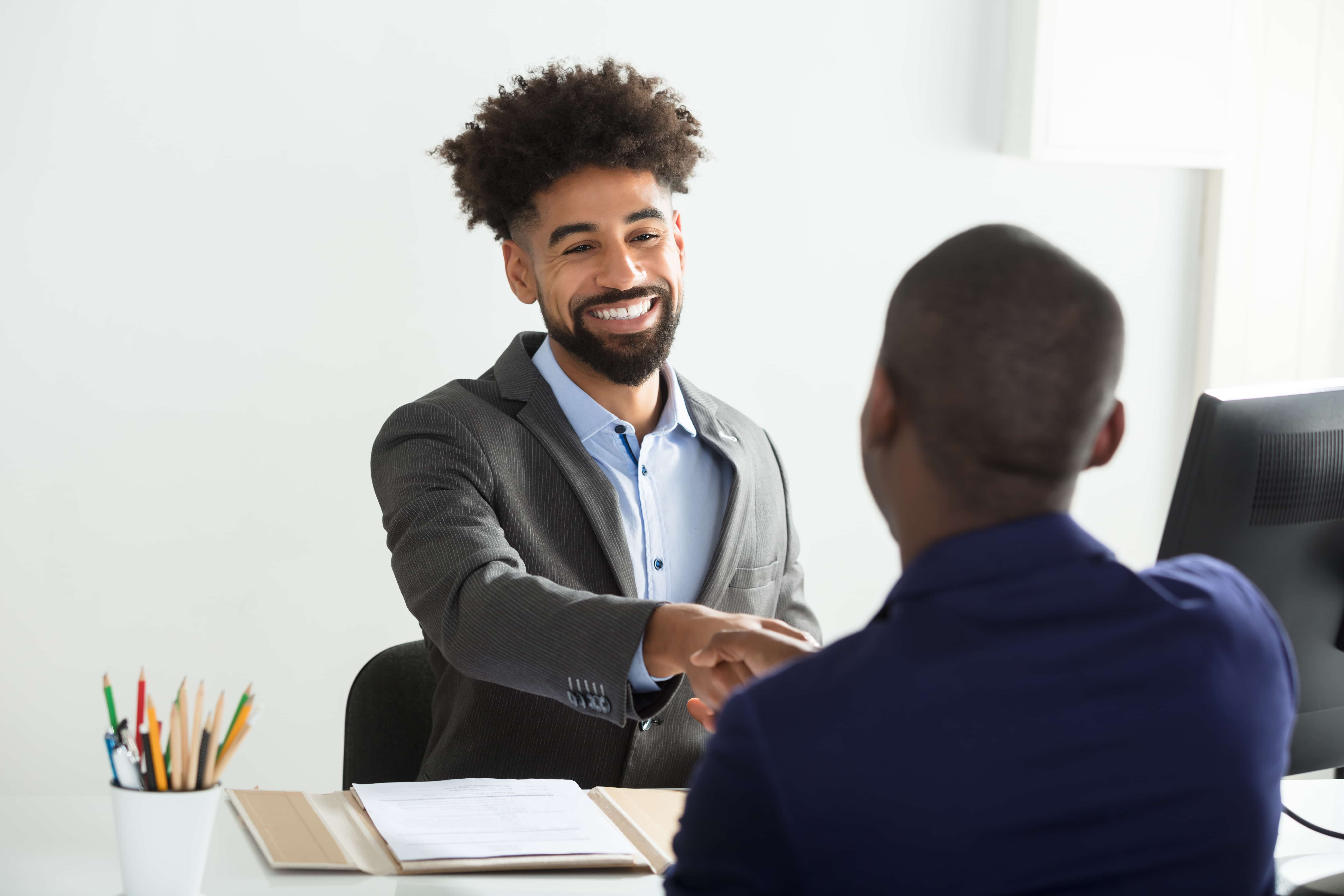 two people shaking hands wioa