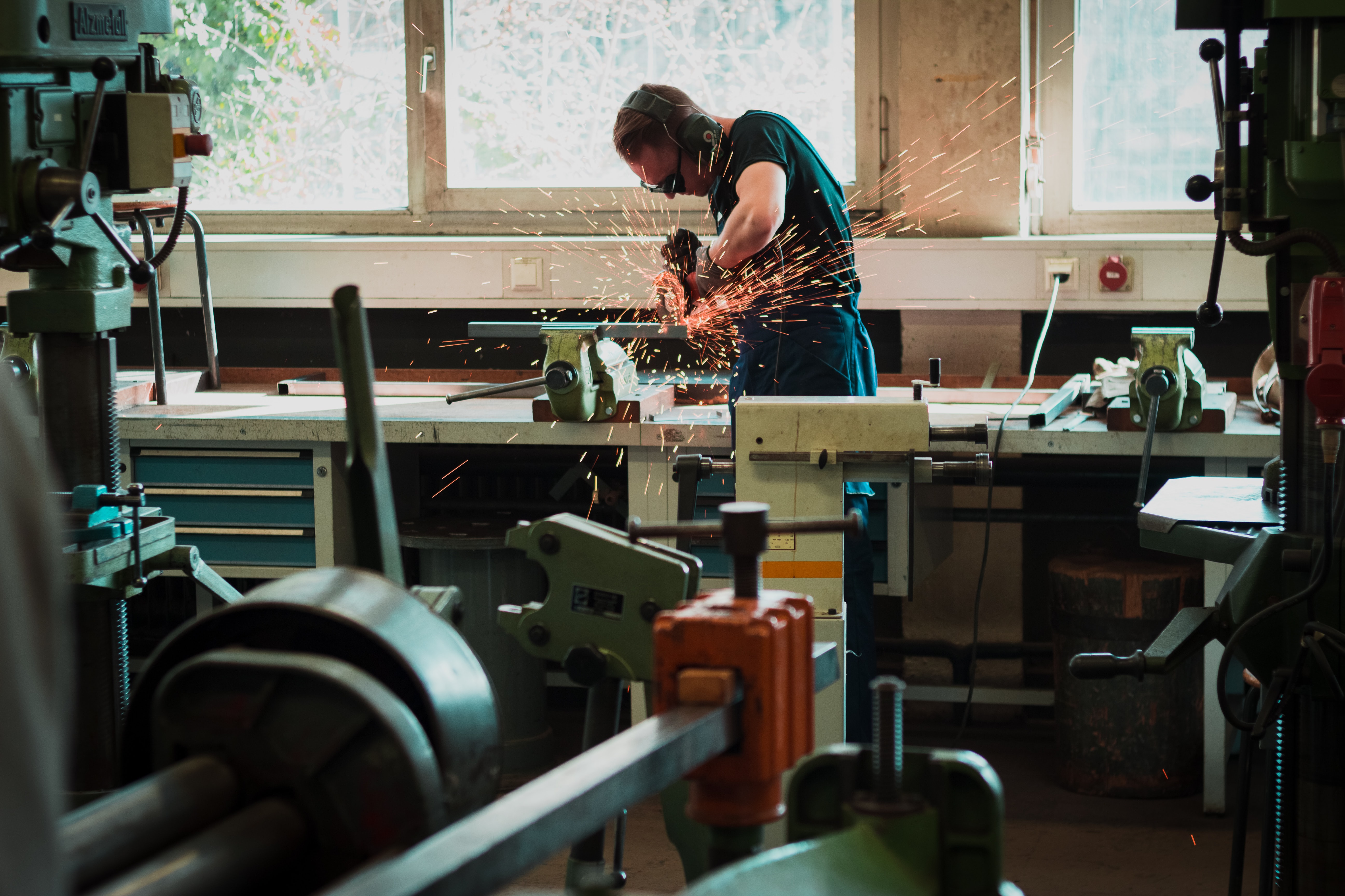 an apprentice welder using tools in a classroom